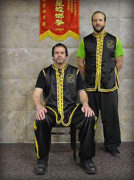 Sifu Mike Deluca (standing) with Sifu Batement (Sitting)